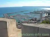 Marina & Port viewed through a canon port of Santa Barbara Castle